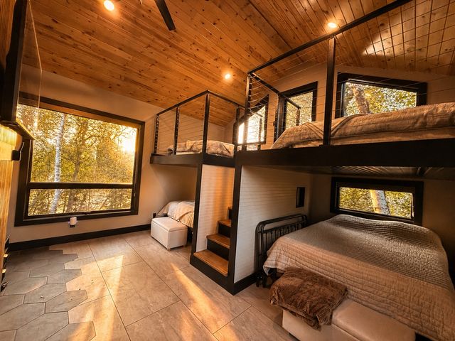 Treetops Bunk House with built-in queen bunks and fireplace