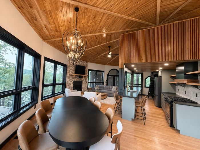 Dining table for the whole group beneath the cedar ceiling